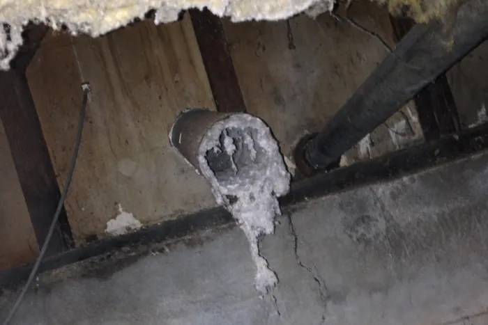 One of Steve's real job photos: a crawlspace dryer duct packed completely solid with compacted lint